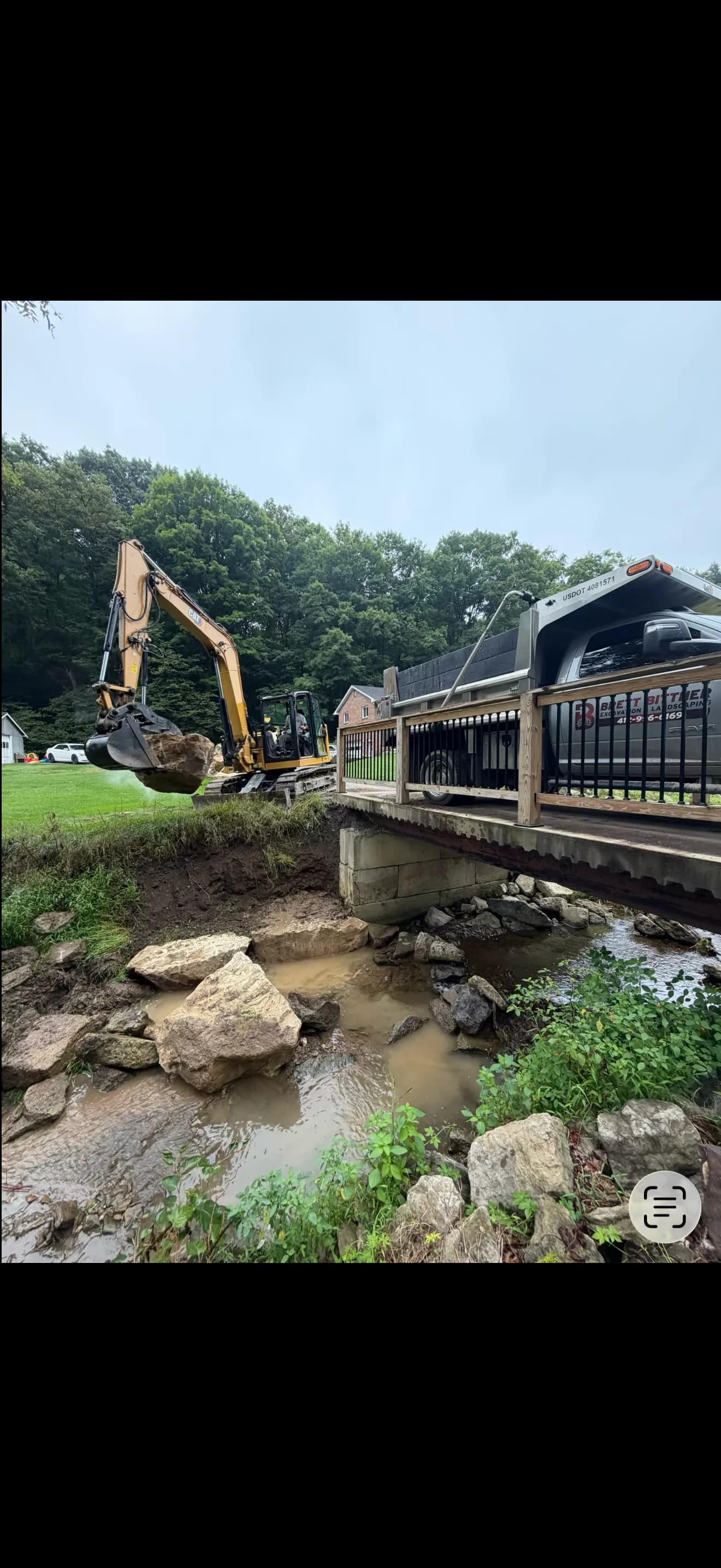 Hillside Washout Fixed With Massive Boulder Erosion Control image