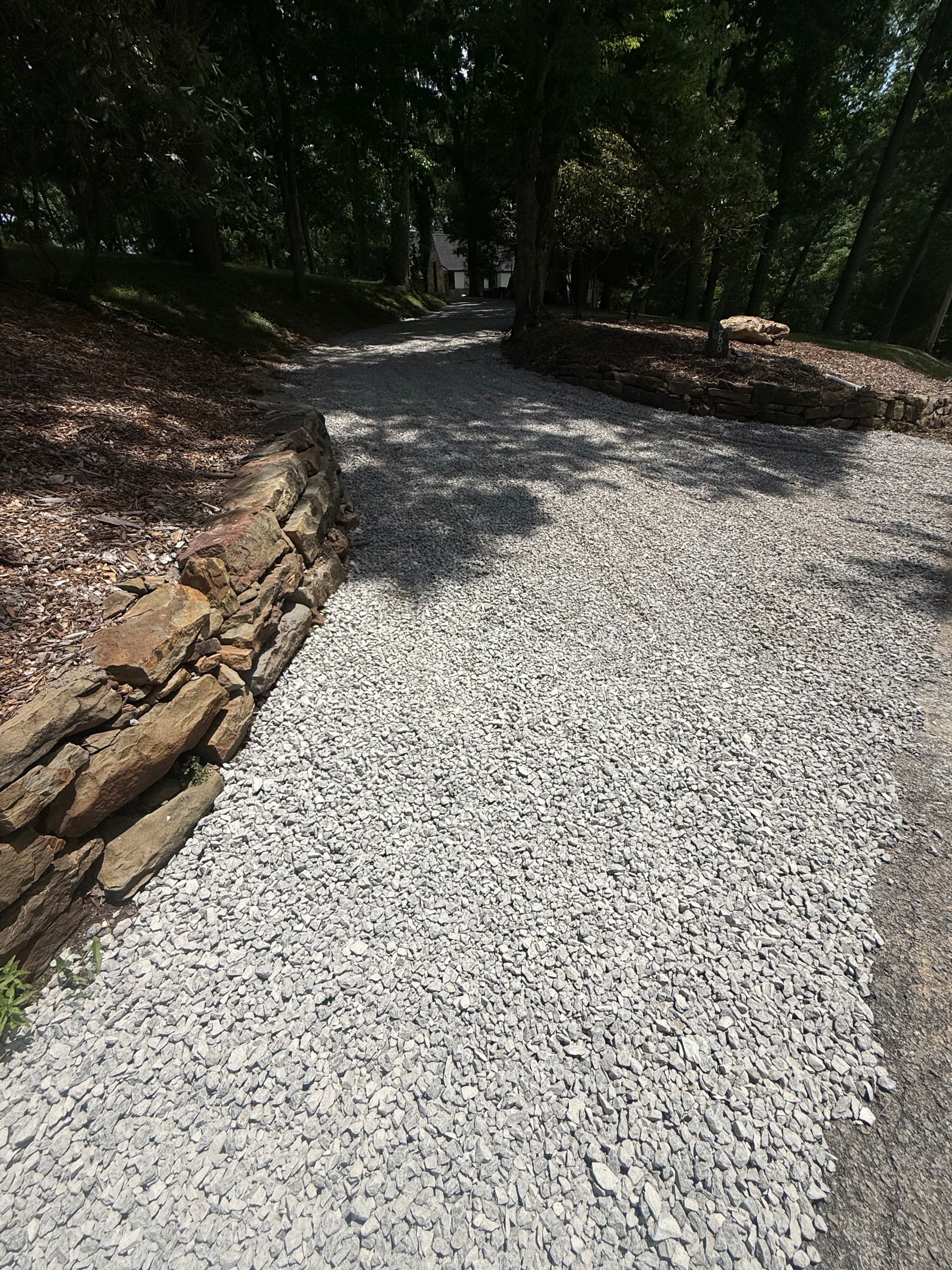 Driveway Drainage Fix with New Catch Basins and Stone Wall Rebuild image