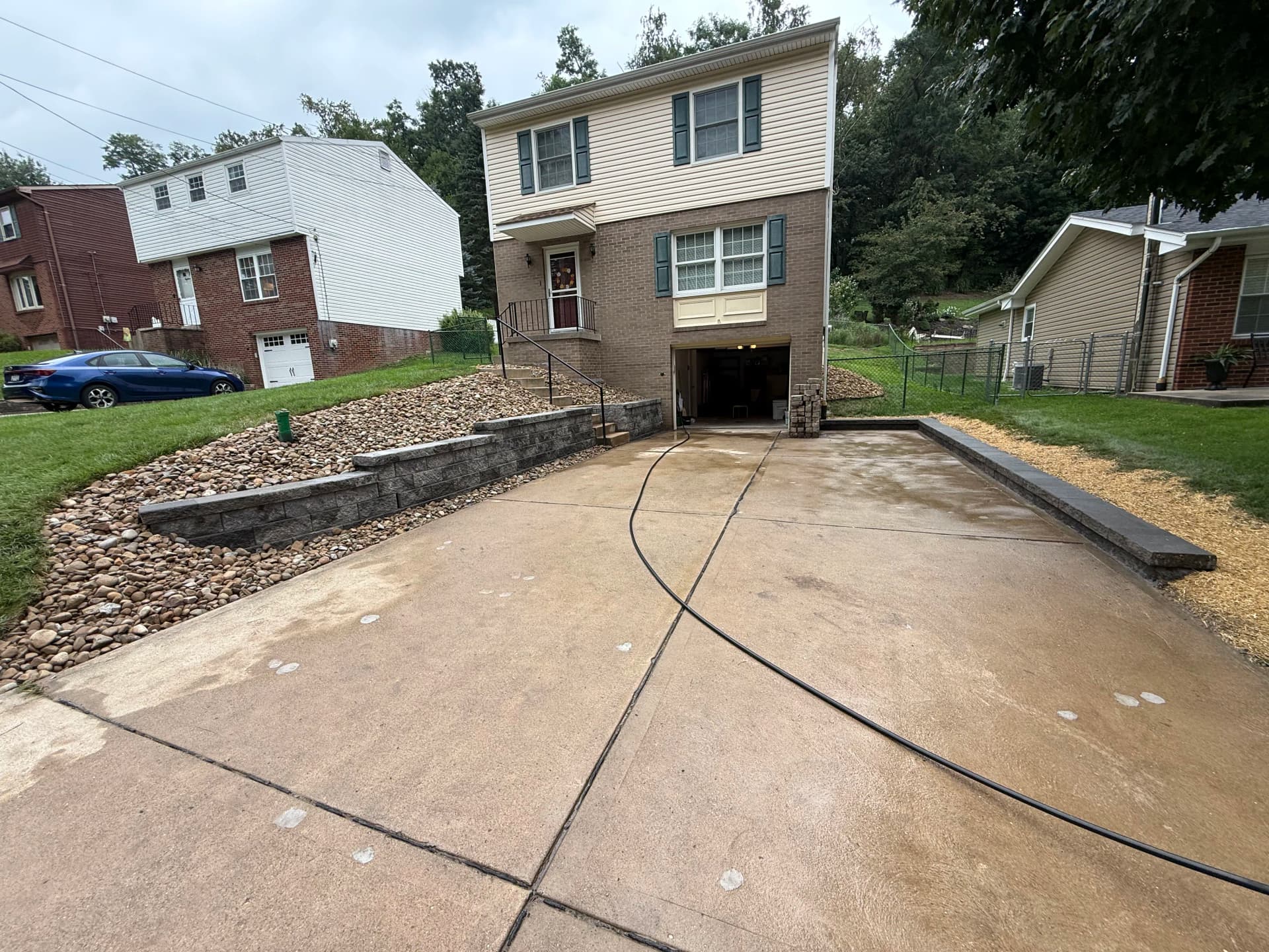 Gallery photos for Slate Versa-Lok Retaining Wall Cleans Up a Sloped Front Yard: Image #1