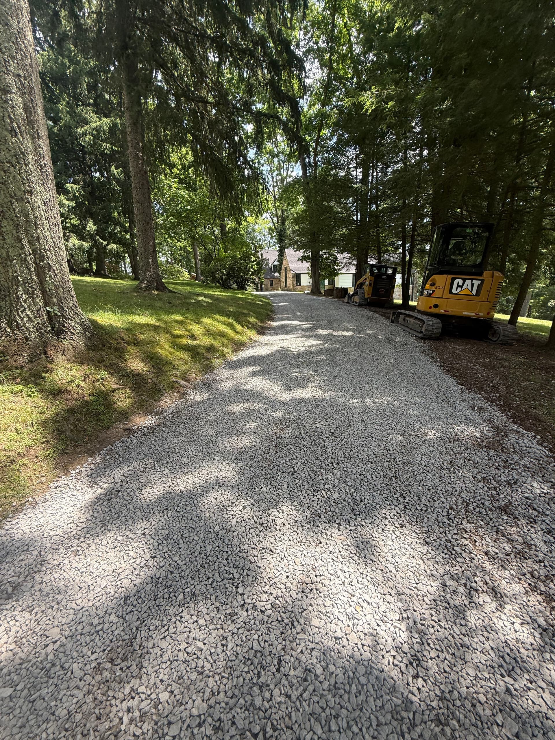 Gallery photos for Driveway Drainage Fix with New Catch Basins and Stone Wall Rebuild: Image #1