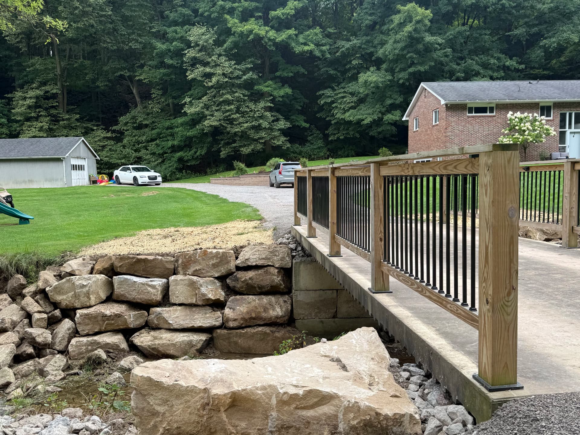 Gallery photos for Hillside Washout Fixed With Massive Boulder Erosion Control: Image #1